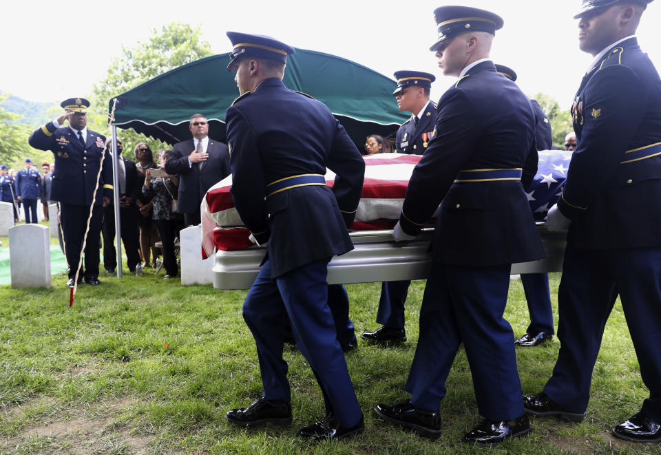 Superintendent Darryl Williams, back left, salutes as the Military honor guard carry the casket of West Point Cadet Christopher J. Morgan, during the interment ceremony at West Point, N.Y., Saturday, June 15, 2019. Over 1500 family, friends and military personnel attended, as well as former President Bill Clinton who delivered remarks at the memorial service. (Mark Vergari/The Journal News via AP)