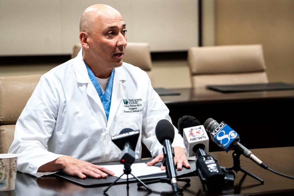 Dr. Carlos Pelaez, medical director for trauma services at Iowa Methodist Medical Center, speaks during a patient update at the Education and Research Center on Friday in Des Moines.