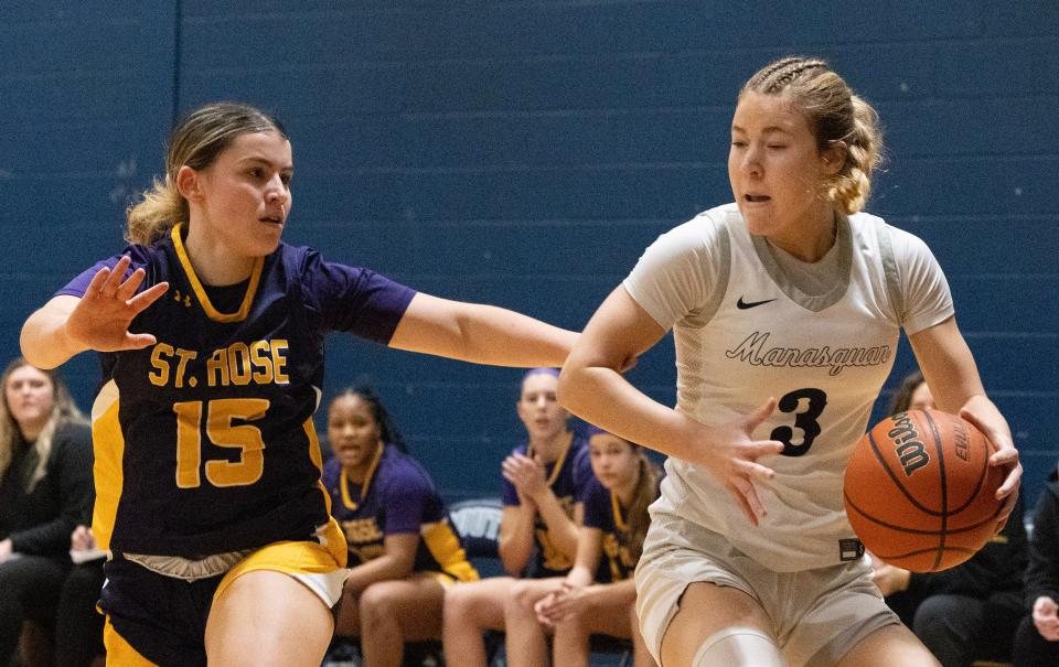 Manasquan Jordyn Hollawell drives to the basket as St Rose’s Belle Alvarado works to cover her. St. Rose Girls Basketball vs Manasquan SCT Quarterfinal game in Middletown, NJ on February, 10 2024