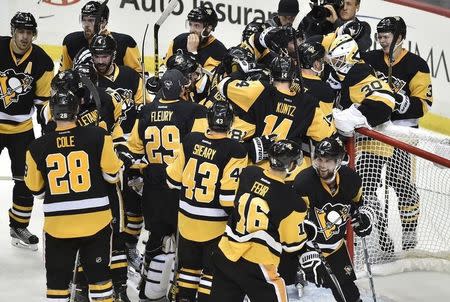 May 26, 2016; Pittsburgh, PA, USA; The Pittsburgh Penguins celebrate after defeating the Tampa Bay Lightning 2-1 in game seven of the Eastern Conference Final of the 2016 Stanley Cup Playoffs at Consol Energy Center. Don Wright-USA TODAY Sports