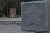 A plinth of the Soviet monument, which has been demolished by unidentified perpetrators, in Koszalin, Poland, Friday, Aug. 26, 2022. Russia's invasion of Ukraine has led to a renewed push to topple the last remaining monuments to the Soviet army that remained in Europe. At the end of the communist era, when Poland and its neighbors threw off Moscow-backed communist regimes, those countries began renaming streets and toppling statues of Lenin and other communist figures. But many memorials to the Red Army remained. (AP Photo/Michal Dyjuk)