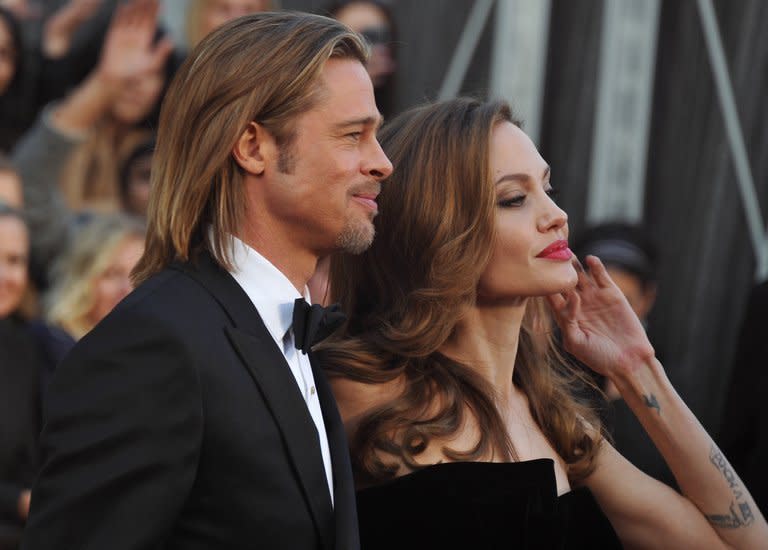 Actress Angelina Jolie and actor Brad Pitt arrive for the Oscars on February 26, 2012 in Hollywood, California. Jolie has revealed that she underwent a double mastectomy to reduce her high risk of breast cancer, saying she is speaking out to encourage women to address threats to their health