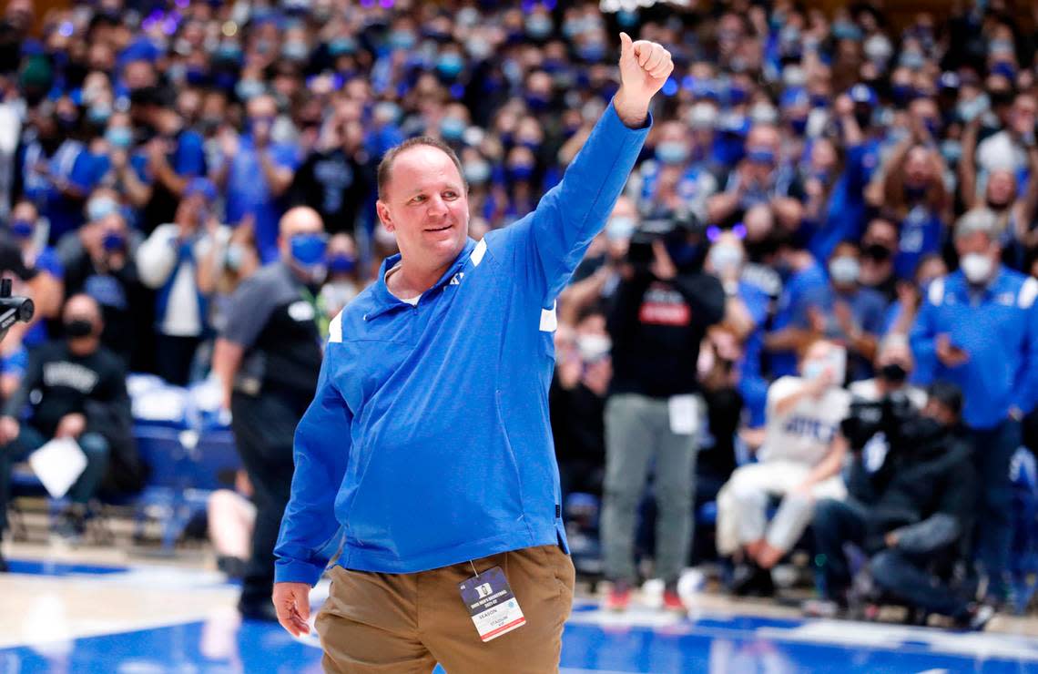 New Duke football coach Mike Elko acknowledges the crowd as he is introduced during Duke basketball game against S.C. State at Cameron Indoor Stadium in Durham, N.C., Tuesday, December 14, 2021.