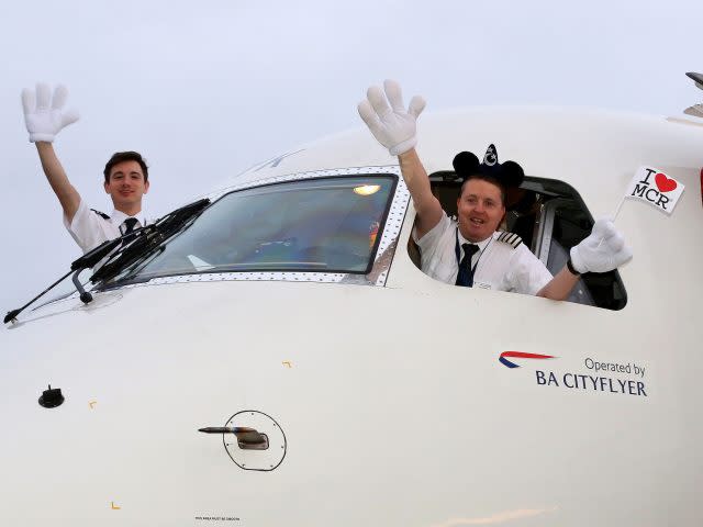 Pilot Bruce Cleghorne and co-pilot Ralph Turan pose for a photograph (Peter Byrne/PA)