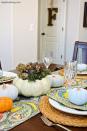 <p>Throw a patterned runner underneath these pumpkin succulent centerpieces for a bright and cheery tablescape. </p><p><strong>Get the tutorial at <a rel="nofollow noopener" href="https://www.anightowlblog.com/thanksgiving-tablescape-succulent-centerpiece/" target="_blank" data-ylk="slk:A Night Owl.;elm:context_link;itc:0;sec:content-canvas" class="link ">A Night Owl. </a></strong></p>