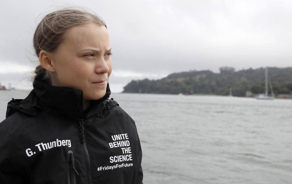 Climate change activist Greta Thunberg arrives to board the Malizia II boat in Plymouth, England, Wednesday, Aug. 14, 2019. The 16-year-old climate change activist who has inspired student protests around the world will leave Plymouth, England, bound for New York in a high-tech but low-comfort sailboat.(AP Photo/Kirsty Wigglesworth, pool)
