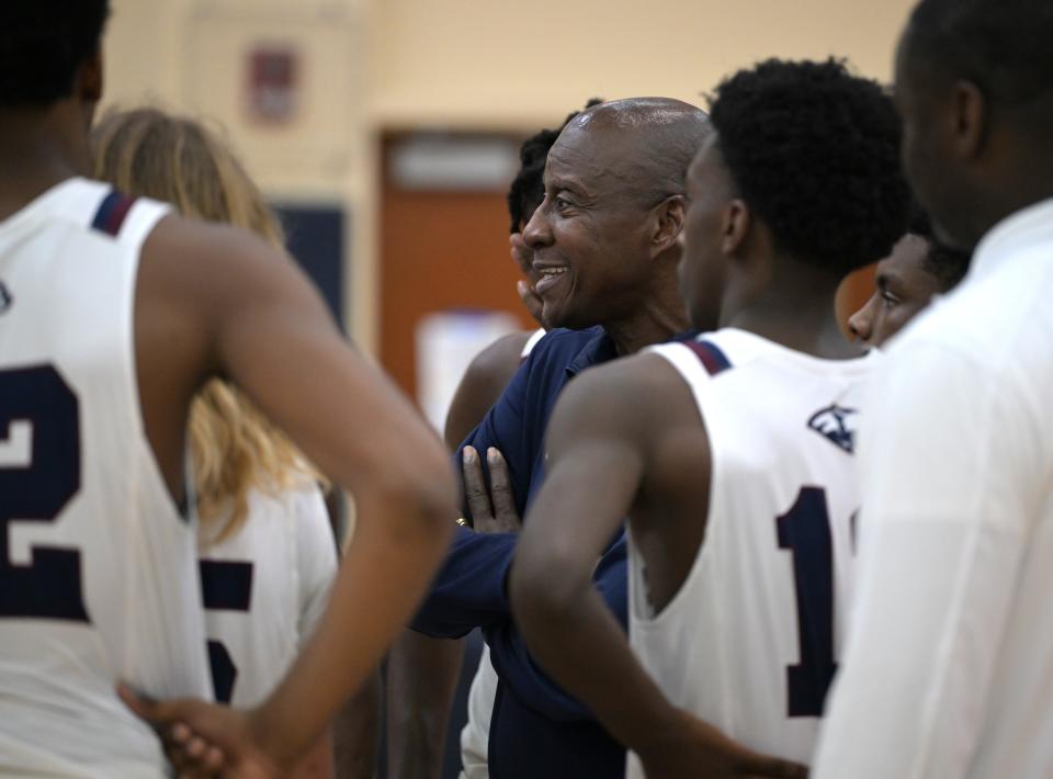 Dwyer basketball coach Fred Ross talks strategy with his team during a time out during an HBC Showcase game against Park Vista on Dec. 28, 2023.