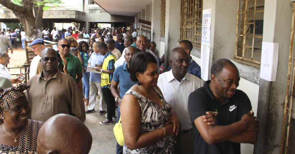 Voters queue to cast their votes in Maputo, Mozambique, Tuesday, Oct. 15, 2019 in the country's presidential, parliamentary and provincial elections. Polling stations opened across the country with 13 million voters registered to cast ballots in elections seen as key to consolidating peace in the southern African nation. (AP Photo/Ferhat Momade)