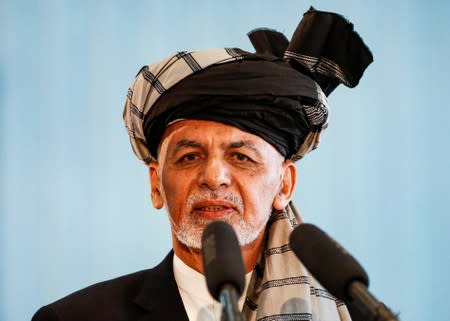 Afghan presidential candidate Ashraf Ghani speaks after casting his vote in the presidential election in Kabul, Afghanistan
