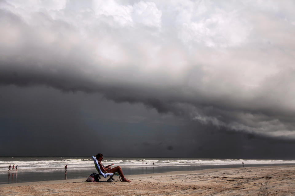 A resident of Amelia Island sunbathes before Hurricane Dorian hits Jacksonville, Florida 