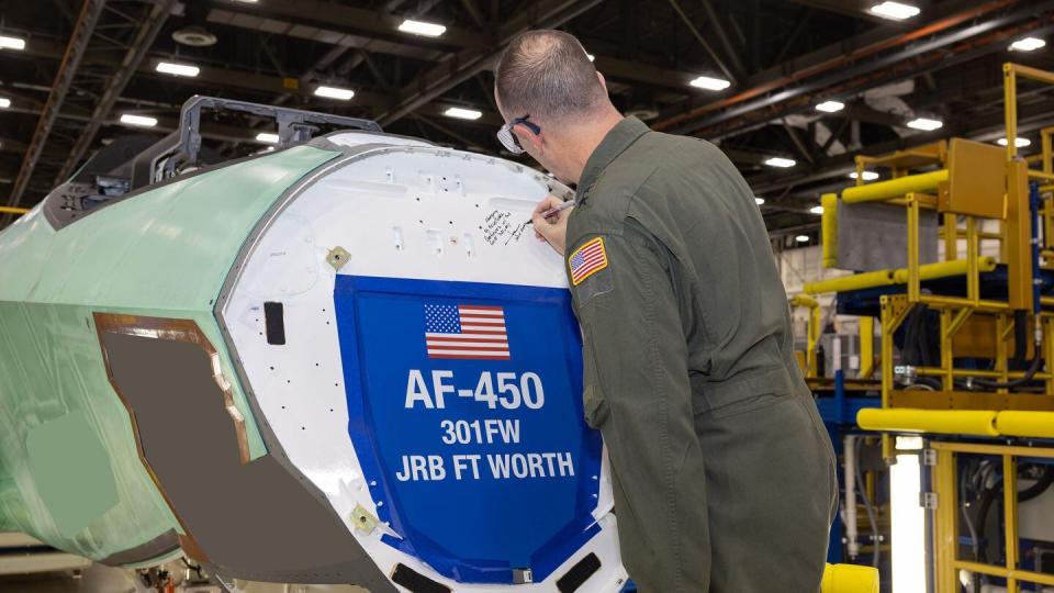 Air Force Reserve Commander Lt. Gen. John Healy signs the bulkhead of an F-35A Lightning II headed for the 301st Fighter Wing at Naval Air Station Joint Reserve Base Fort Worth, Texas, during an event at Lockheed Martin's Fort Worth production facility, April 3, 2024. (Chris Hanoch/Lockheed Martin)