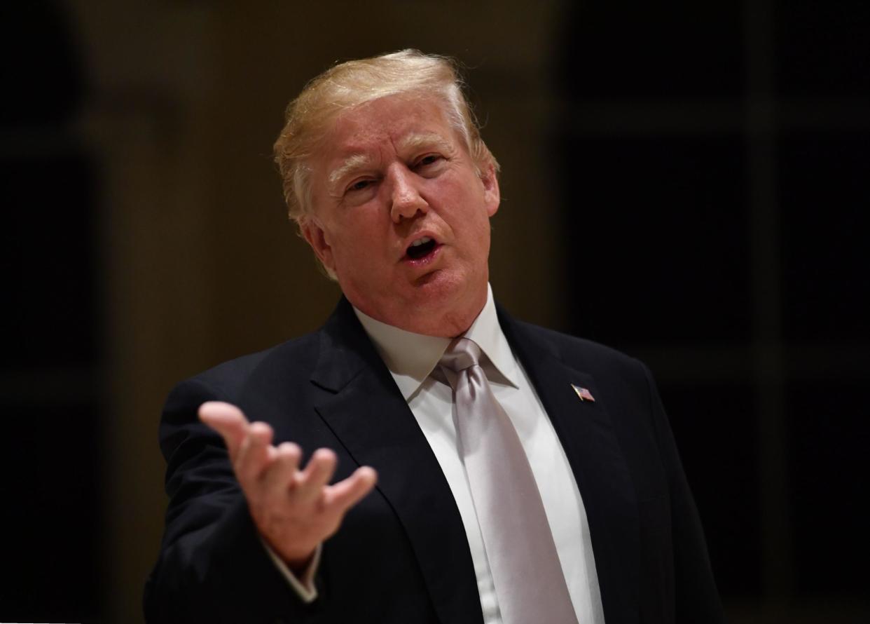 US President Donald Trump speaks to reporters at Trump International Golf Club in West Palm Beach: AFP/Getty