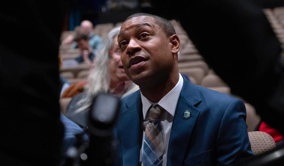 Olympia mayor-elect Dontae Payne talks with Thurston County Sheriff Derek Sandersi during swearing-in ceremonies for newly elected Thurston County officials at South Puget Sound Community College in Olympia, Washington, on Wednesday, Dec. 27, 2023.