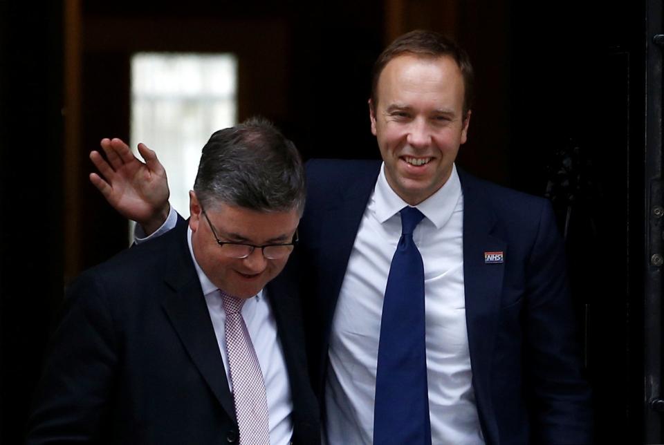 Britain's Health and Social Care Secretary Matt Hancock and Britain's Justice Secretary Robert Buckland are seen outside Downing Street in London (REUTERS)