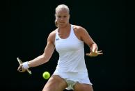 <p>Kiki Bertens of The Netherlands plays a forehand during the Ladies Singles second round match against Mona Barthel of Germany on day four of the Wimbledon Lawn Tennis Championships at the All England Lawn Tennis and Croquet Club on June 30, 2016 in London, England. (Photo by Shaun Botterill/Getty Images)</p>