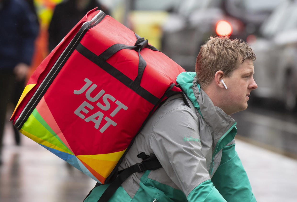 CARDIFF, UNITED KINGDOM - MAY 29: A Just Eat food delivery rider on May 29, 2019 in Cardiff, United Kingdom. (Photo by Matthew Horwood/Getty Images)
