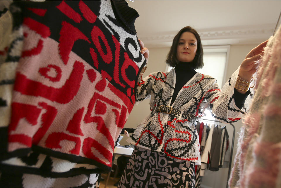 Fashion designer Sam Leutton originally from Stockport northern England, poses for a portrait at her booth in Somerset House, the main centre for London Fashion Week, where she is showing her designs in London, Monday, Feb. 17, 2014. A tale of two Britains has emerged after the Great Recession on this economically hobbled island. While politicians trumpet the country’s recovery from the financial crisis and its status as the world’s fastest growing developed economy, the figures point to a growing divide, one that pits London’s growing boom against the malaise in once-affluent cities such as Manchester that are struggling to remain vibrant in the 21st century.(AP Photo/Alastair Grant)