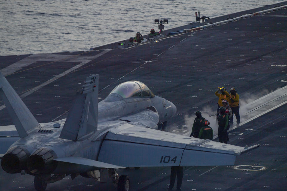 In this photograph released by the U.S. Navy, an F/A-18 Super Hornet prepares to launch off the flight deck of the Nimitz-class aircraft carrier USS Theodore Roosevelt on July 5, 2024, in the South China Sea. The Roosevelt is replacing the USS Dwight D. Eisenhower in the Navy's campaign against attacks by Yemen's Houthi rebels targeting shipping in the Red Sea corridor over the Israel-Hamas war in the Gaza Strip. (Seaman Aaron Haro Gonzalez/U.S. Navy, via AP)