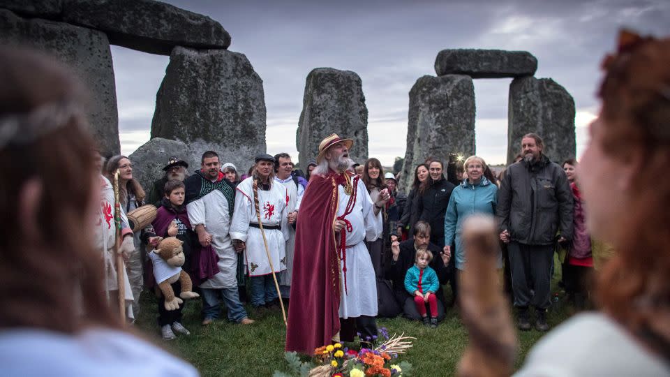 Druids, pagans and revelers gather in the center at Stonehenge in England to celebrate the autumnal equinox on September 23, 2017. - Matt Cardy/Getty Images