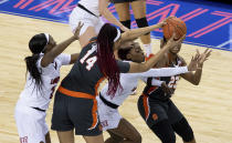 Syracuse's Kamilla Cardoso (14) attempts to pass the ball to teammate Kiara Lewis (23) as Syracuse's Amaya Finklea-Guity, left, and Taleah Washington, second from right, defend during the first half of an NCAA college basketball game in the semifinals of Atlantic Coast Conference tournament in Greensboro, N.C., Saturday, March 6, 2021. (AP Photo/Ben McKeown)