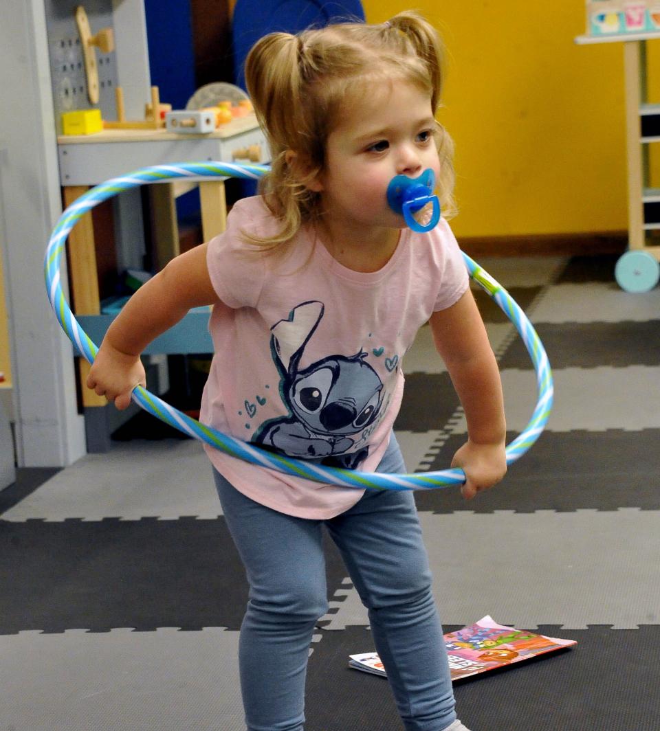 Lena Miller, age 1 and 1/2, practices her hula hoop skills at Kidz Towne in Wooster.