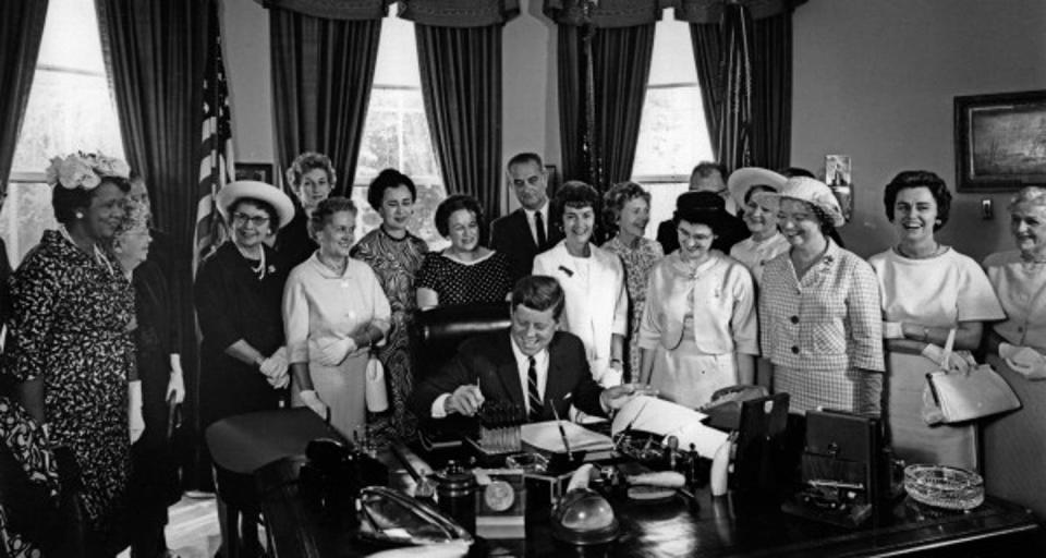 <span class="caption">John F. Kennedy signs the Equal Pay Act into law.</span> <span class="attribution"><a class="link " href="https://en.wikipedia.org/wiki/Equal_Pay_Act_of_1963#/media/File:American_Association_of_University_Women_members_with_President_John_F._Kennedy_as_he_signs_the_Equal_Pay_Act_into_law.jpg" rel="nofollow noopener" target="_blank" data-ylk="slk:Abbie Rowe/JFK Presidential Library and Museum;elm:context_link;itc:0;sec:content-canvas">Abbie Rowe/JFK Presidential Library and Museum</a>, <a class="link " href="http://creativecommons.org/licenses/by/4.0/" rel="nofollow noopener" target="_blank" data-ylk="slk:CC BY;elm:context_link;itc:0;sec:content-canvas">CC BY</a></span>