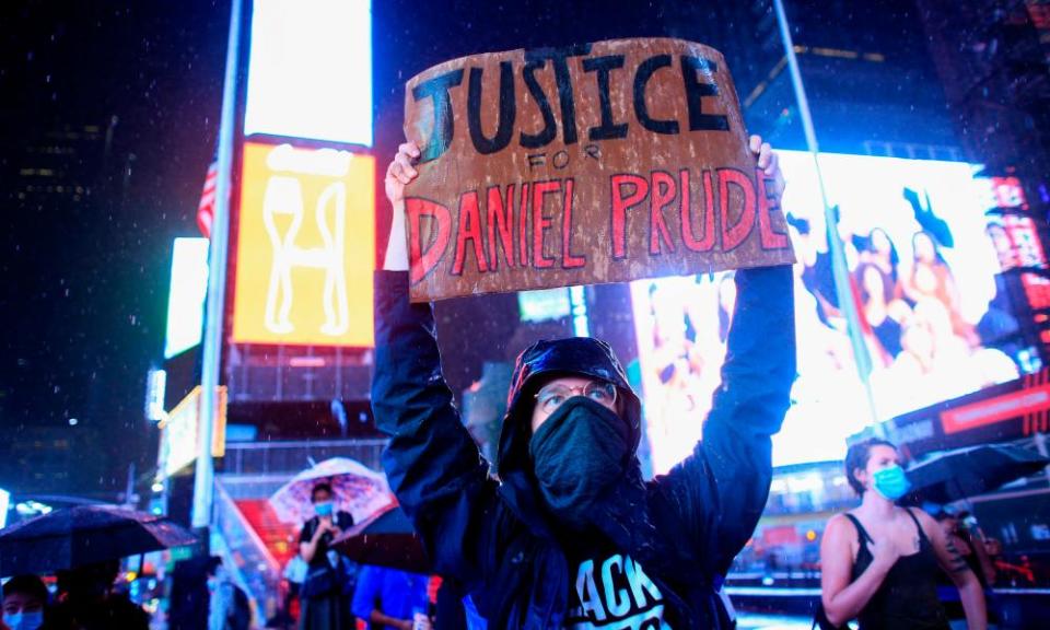 A demonstrator holds a sign during a protest to demand justice for Daniel Prude in New York