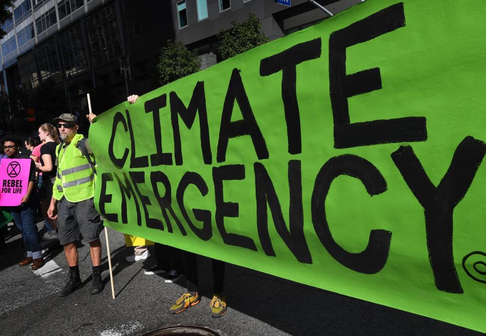 Activists in Los Angeles call for action on climate&nbsp;change on Jan. 26.&nbsp;President Donald Trump has dismissed a report by his own government warning of devastating effects from global warming. (Photo: MARK RALSTON via Getty Images)