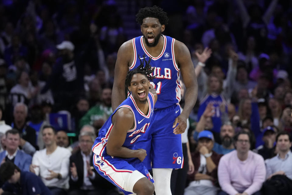 Philadelphia 76ers' Tyrese Maxey, left, and Joel Embiid react after a basket during the second half of an NBA basketball game against the Boston Celtics, Wednesday, Nov. 8, 2023, in Philadelphia. (AP Photo/Matt Slocum)