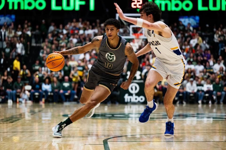 Colorado State University's 
Nique Clifford (10) drives towards the basket during their game against San Jose State at Moby Arena on Friday, Febuary 9. Rams lead at the half 38-19.