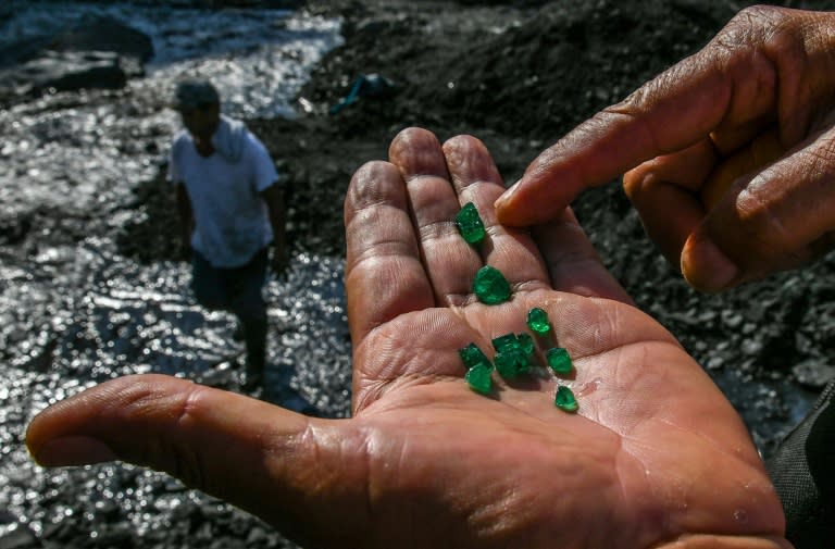 An emerald seeker shows some of the green gems found in the Las Animas river close to a mine in Muzo, Colombia -- known as the "emerald capital of the world"