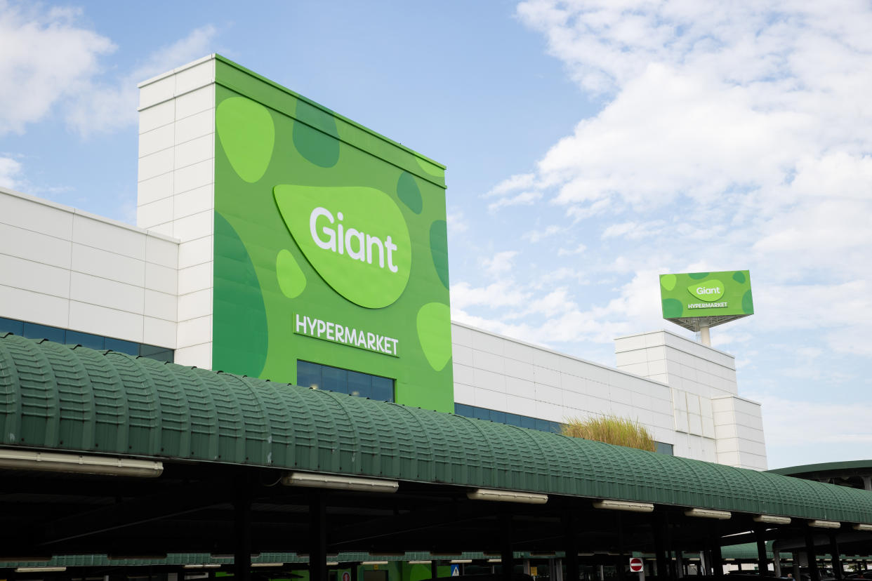 Giant outlet with green signboard.