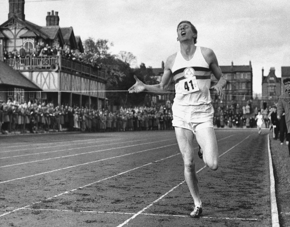 In this May 6, 1954, file photo, British athlete Roger Bannister breaks the tape to become the first man ever to break the four minute barrier in the mile at Iffly Field in Oxford, England. 