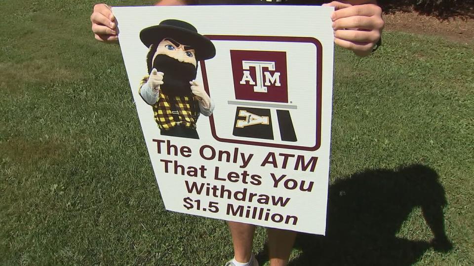 Appalachian State University freshman Zackary Carr holds up his winning poster from ESPN College GameDay.