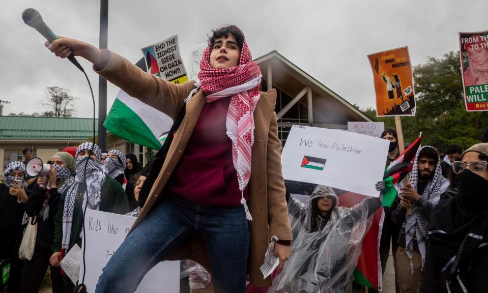 Danya Zituni chants Free Palestine in front of hundreds of community members during the All Out for Palestine rally, organized by the Palestinian Youth Movement (PYM) and local chapters of Students for Justice in Palestine (SJP) in Dearborn on Saturday, Oct. 14, 2023.