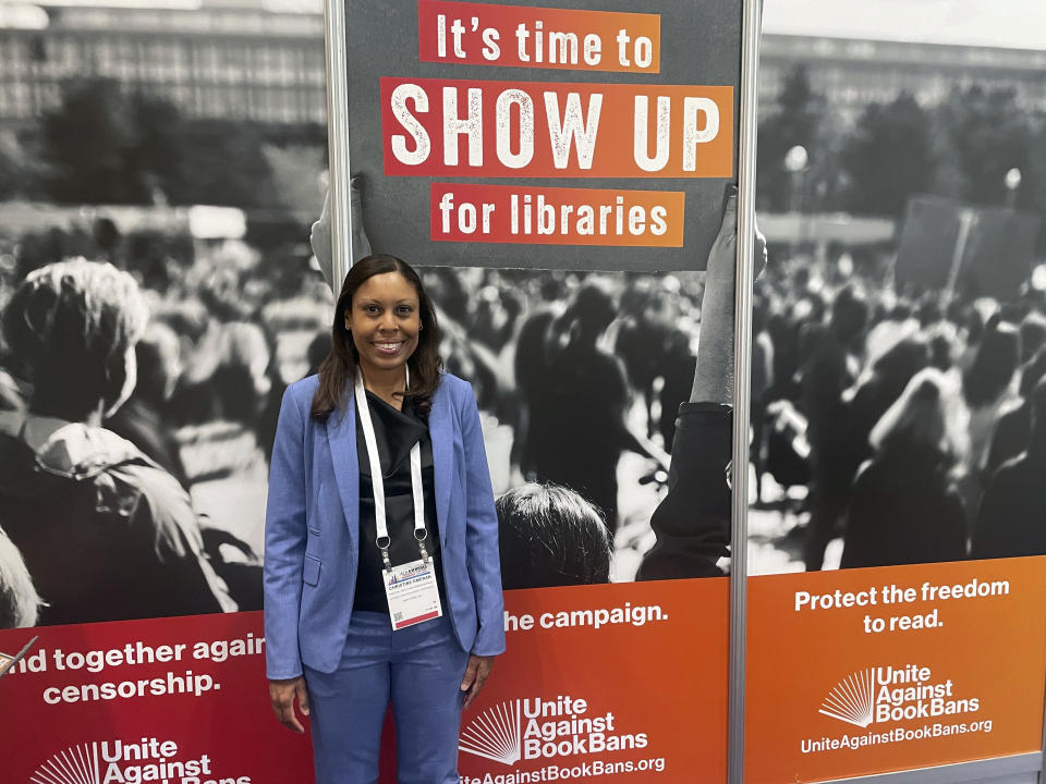 Christine Emeran, director of the Youth Free Expression Program of the National Coalition Against Censorship, a First Amendment advocacy organization, poses at a Unite Against Book Bans exhibit at the American Library Association's annual conference, Saturday, June 24, 2023, at McCormick Place in Chicago. Parents always have the right to choose what their children read, but they don't have the right to restrict access for the whole community, Emeran said. (AP Photo/Claire Savage)