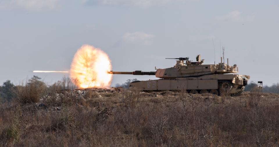 Soldiers fire the main gun of an M1A2 Abrams tank during an exercise at Fort Benning, Ga., Jan. 30, 2020.