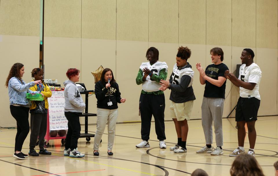 Purdue Boilermaker football freshman offensive lineman André Oben, offensive lineman Malachi Preciado, Purdue student Andrew Buban and defensive end Nic Caraway ask students for their best test advice, during Edgelea Elementary School's ILEARN prep rally, on Friday, April 7, 2023, in Lafayette, Ind.
