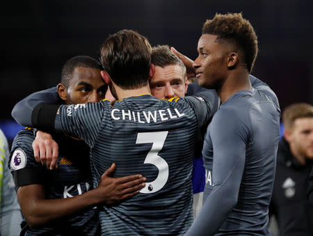 Soccer Football - Premier League - Cardiff City v Leicester City - Cardiff City Stadium, Cardiff, Britain - November 3, 2018 Leicester City's Ben Chilwell embraces Jamie Vardy after the match REUTERS/Darren Staples .