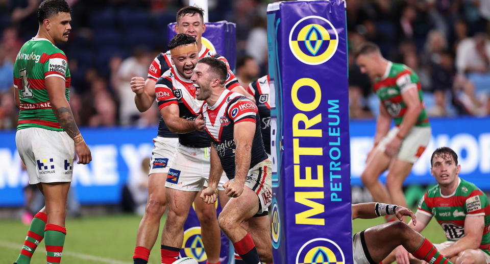 Seen here, James Tedesco celebrates after scoring a try under the posts for the Roosters.