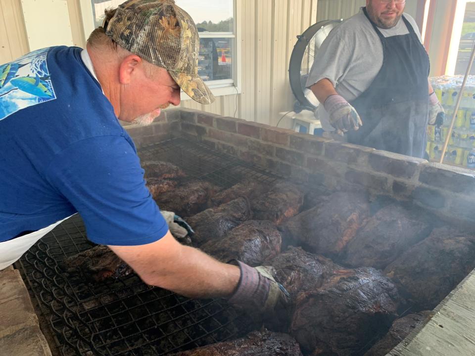 Earl Buckles carries on the family tradition of slow-cooking the beef for a previous edition of the annual Cracker Day celebration in DeLand. The event returns on Saturday to the Volusia County Fairgrounds.