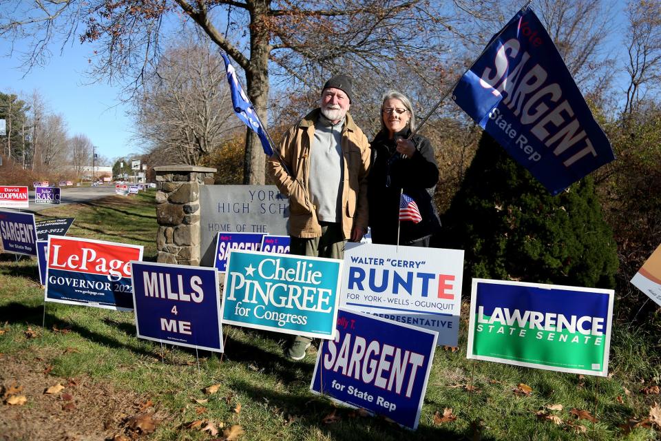 Locals stand with signs supporting their candidate outside of York High School on Tuesday, November 8, 2022.