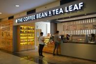 Customers line up at a branch of The Coffee Bean & Tea Leaf in Manila