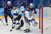 Finland goalkeeper Anni Keisala (36) reaches for a shot by United States' Cayla Barnes, not shown, as the puck gets by Keisala for a goal during a women's semifinal hockey game at the 2022 Winter Olympics, Monday, Feb. 14, 2022, in Beijing. (AP Photo/Petr David Josek)