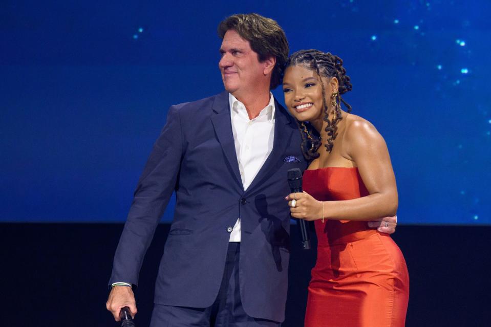 Rob Marshall and Halle Bailey on stage presenting "The Little Mermaid" remake at D23 Expo.