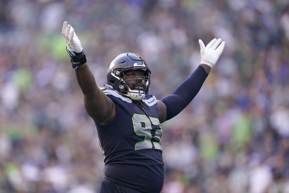 Seattle Seahawks defensive end Shelby Harris (93) gestures toward fans during the second half of an NFL football game against the Arizona Cardinals in Seattle, Sunday, Oct. 16, 2022. (AP Photo/Abbie Parr)