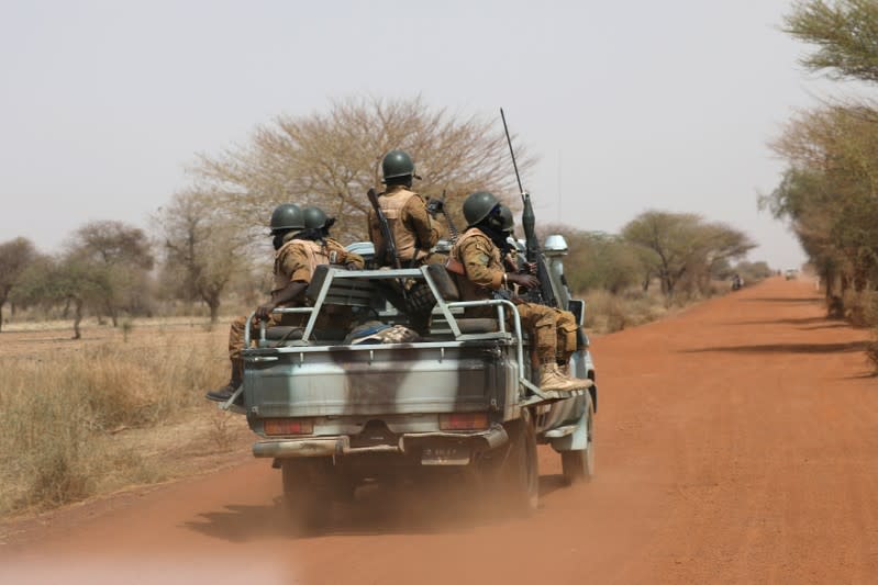 FILE PHOTO: Soldiers from Burkina Faso patrol on the road of Gorgadji in the Sahel area of Burkina Faso
