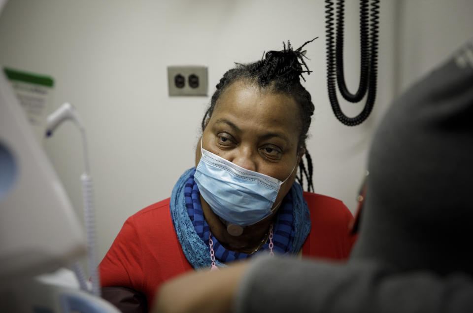 Trachea transplant recipient Sonia Sein gives a blood sample during a checkup visit at Mt. Sinai hospital in New York on Monday, March, 22, 2021. Sein says she had spent the last six years “trying to catch every breath at every moment" after extensive treatment for her severe asthma damaged her windpipe. But she is breathing freely again after a January windpipe transplant. (AP Photo/Marshall Ritzel)