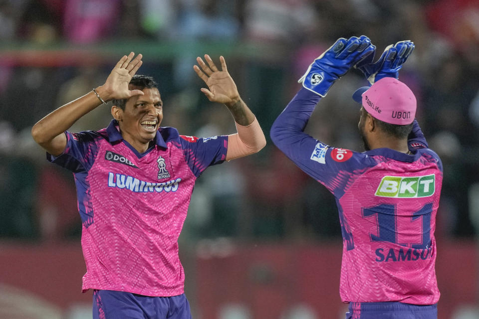 Rajasthan Royals' captain Sanju Samson, right, celebrates with teammate Navdeep Saini the dismissal of Punjab Kings Atharva Taide during the Indian Premier League cricket match between Punjab Kings and Rajasthan Royals in Dharamshala, India, Friday, May 19, 2023. (AP Photo /Ashwini Bhatia)