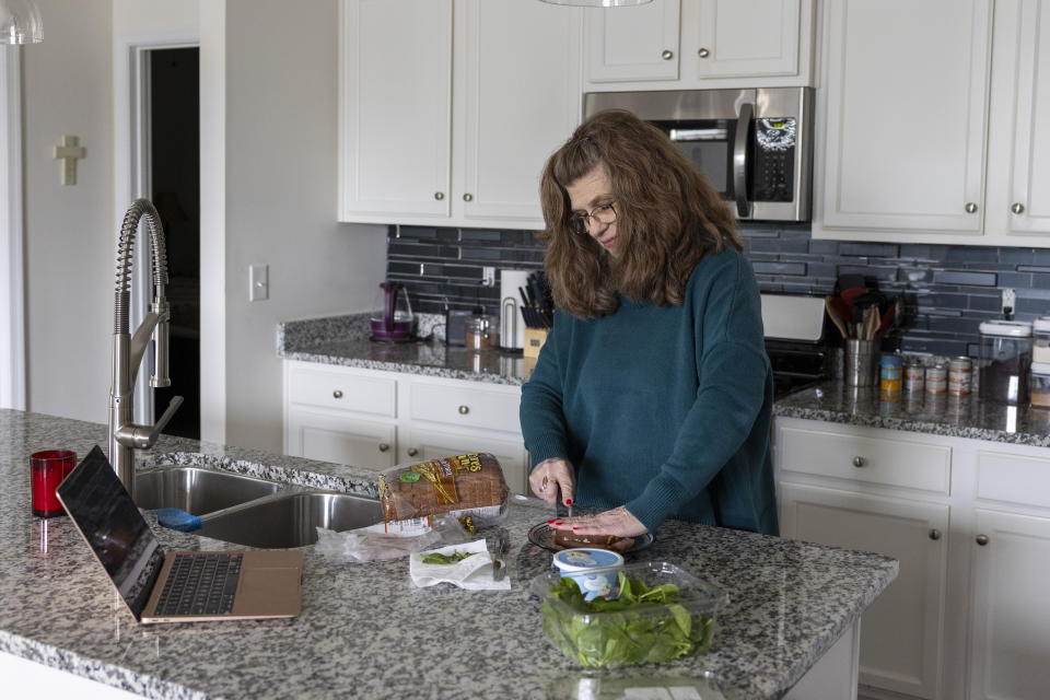 Donna Cooper prepares a roast beef sandwich with a recipe from the Mayo Clinic at her home in Front Royal, Va., on Friday, March 1, 2024. (AP Photo/Amanda Andrade-Rhoades)